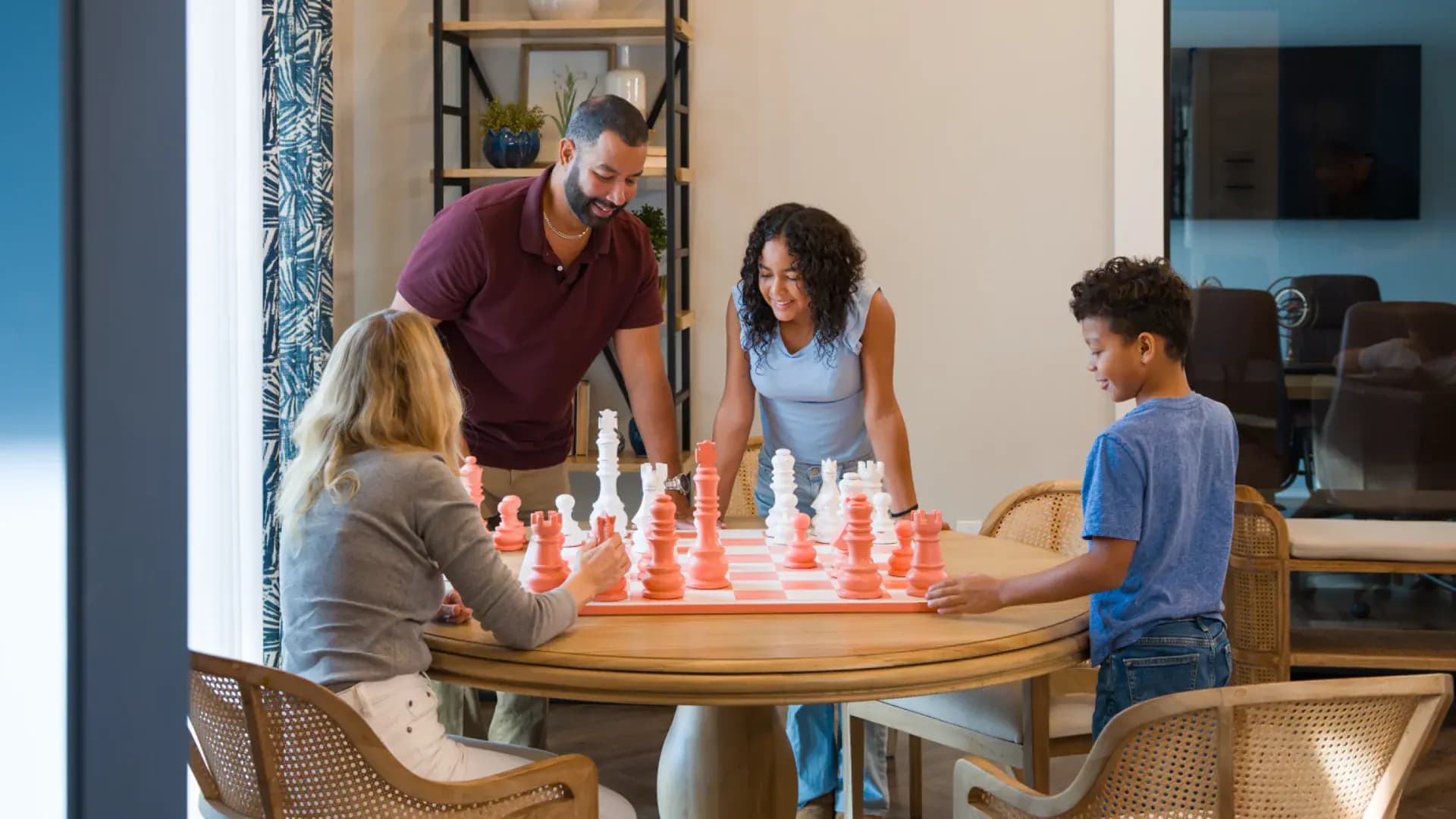 Residents in the clubhouse at a Pointe Grand community
