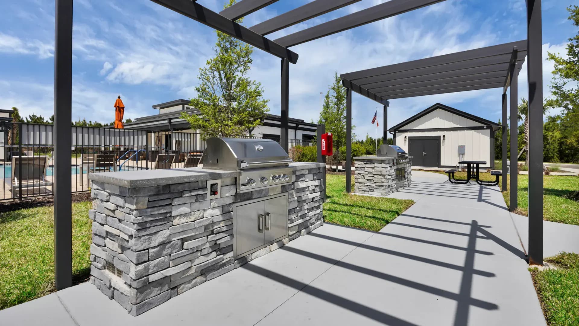 Outdoor kitchen and BBQ grills at a Pointe Grand community
